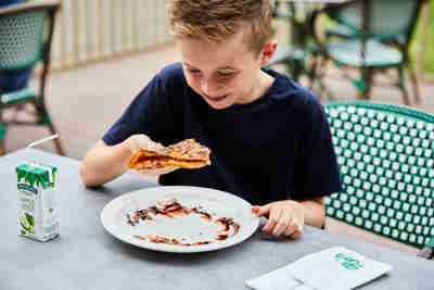 Boy eating waffle