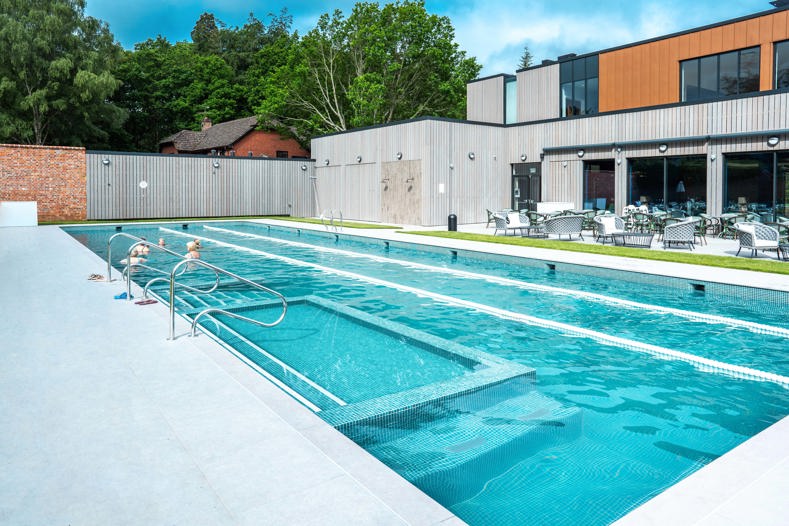 Pool with people swimming and enjoying a corporate retreat